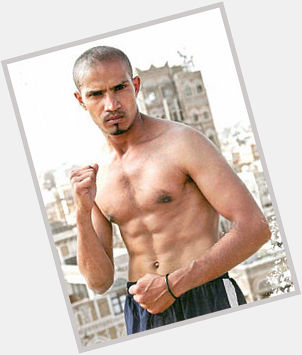 Ali Raymi Athletic body,  dark brown hair & hairstyles