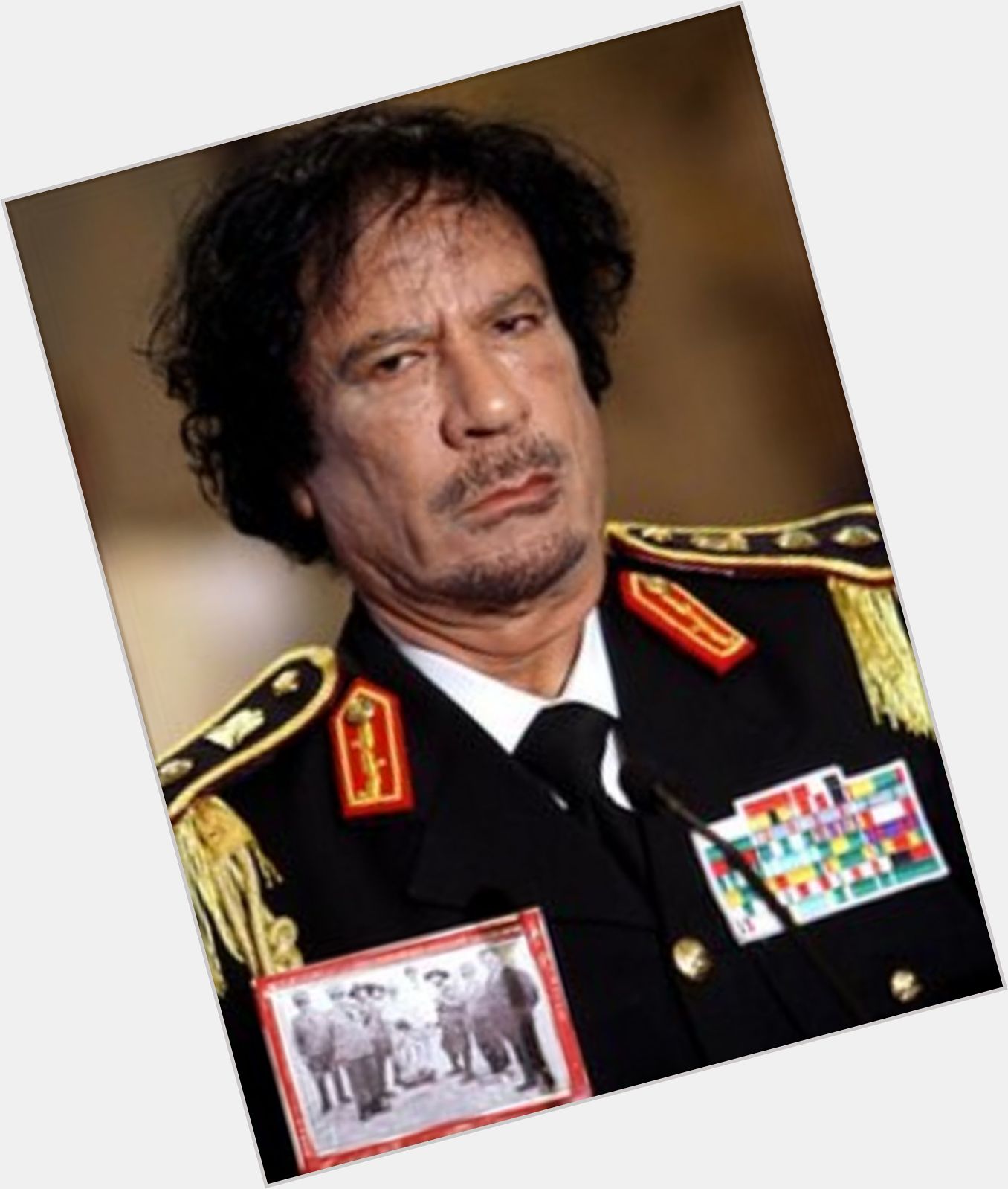 Hannibal Muammar Al Gaddafi Average body,  dark brown hair & hairstyles