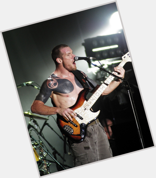 Tim Commerford Athletic body,  light brown hair & hairstyles